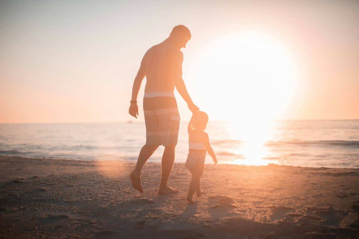A dad and his kid at the beach
